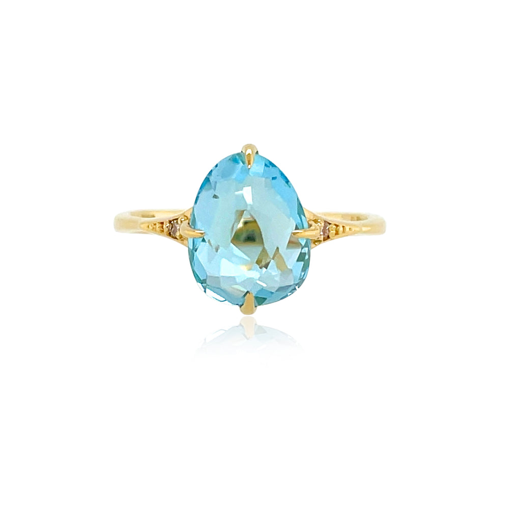 Sugar loaf collection made in Brazil  Tear shape faceted Blue Topaz 4.20 cts  Round small diamonds 0.02 cts  Set in 18k yellow gold  Secure hinged system  11.50 mm.