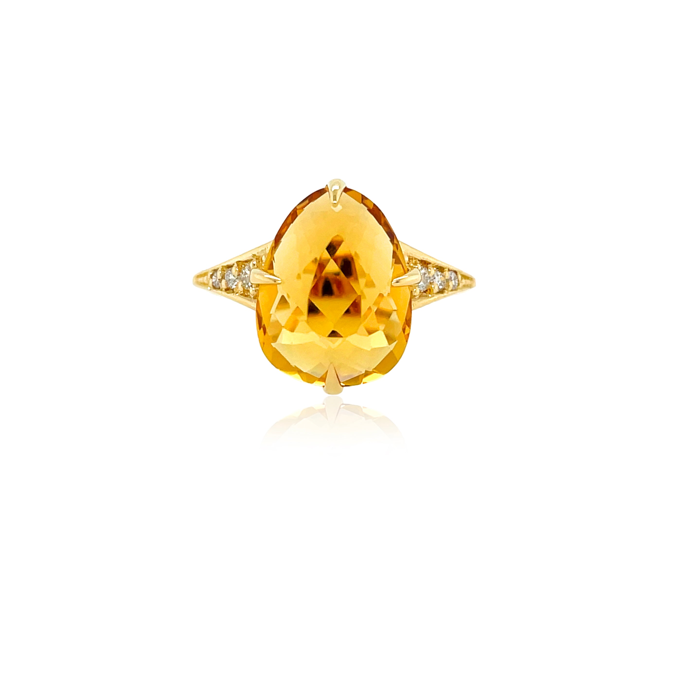 Experience Brazil with our vibrant Sugarloaf collection! A tear-shaped faceted citrine stone of 6.40 cts and 0.09 cts of petite round diamonds twinkle atop an 18 kt yellow gold setting. 15.00 mm.
