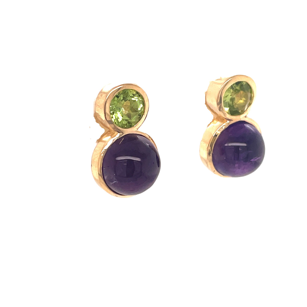 The perfect accessory for any occasion, these 18-karat yellow gold earrings feature an eye-catching combination of round amethyst cabochon and peridot stones. Crafted with a secure friction-back closure and a total length of 15 millimeters, they are a fashion-forward yet timeless piece.