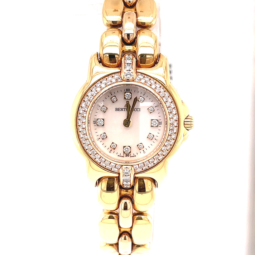 This Bertolucci Diamond Vir 18k yellow gold watch features a 0.55 ct round diamonds on its MOP dial, as well as quartz movement and a stainless steel link bracelet fastened with a deployment buckle. Hour markers are also present in diamond.