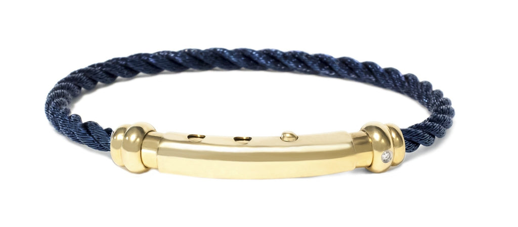 This bracelet creates an elegant look  Italian made stainless steel bracelet  Yellow gold played bad  PVD stainless steel rope  8" long  Secure adjustable clasp  Embellished with one single diamond