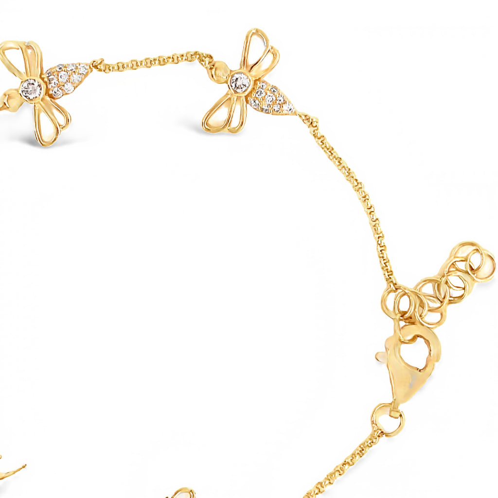 This stunning 0.56 cts diamond bracelet features five diamond bees hand-crafted with 14k yellow gold, and a secure lobster clasp. Measuring 7" in length, with 1" sizeable loops, this bracelet can be stacked or worn alone.