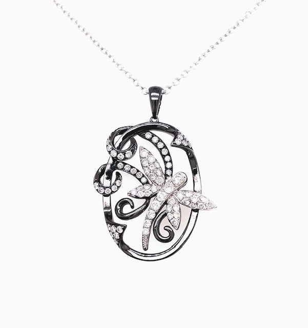 18kt white gold  0.75 cts round diamonds   Diamond dragonfly entwined on pendant border  30.00 mm long (including secure bail)  High quality diamonds   18" white gold chain with secure lobster catch ($250.00 optional) 