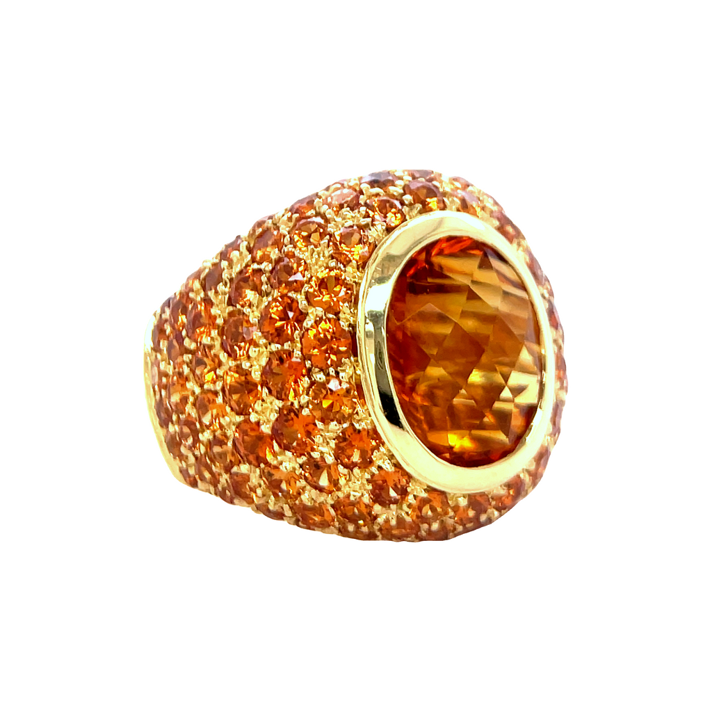 Italian handcrafted ring  Set in 18k yellow gold  Gallery design at the back   Large oval citrine 5.23  Mardarin garnet 7.35 cts  Dome design  Size 7 (sizeable)  21.00 mm lengh