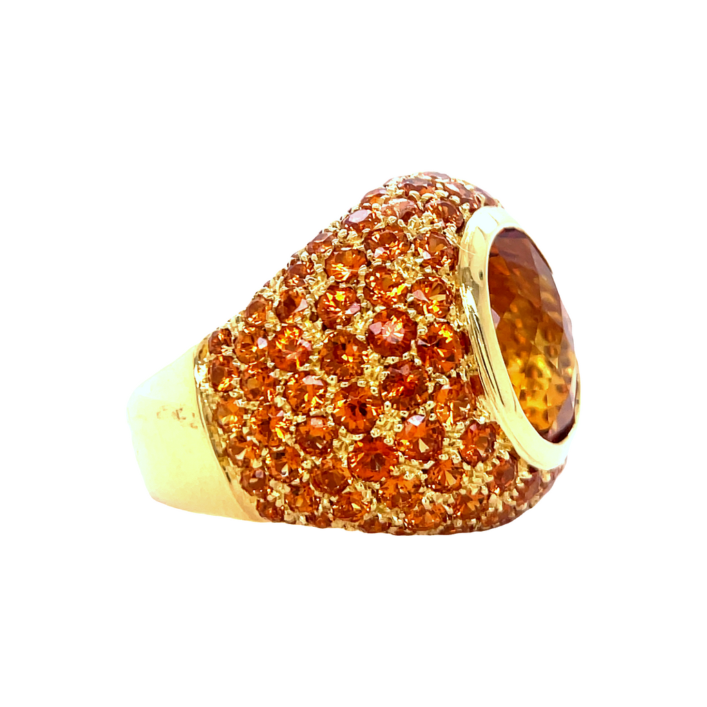 Italian handcrafted ring  Set in 18k yellow gold  Gallery design at the back   Large oval citrine 5.23  Mardarin garnet 7.35 cts  Dome design  Size 7 (sizeable)  21.00 mm lengh