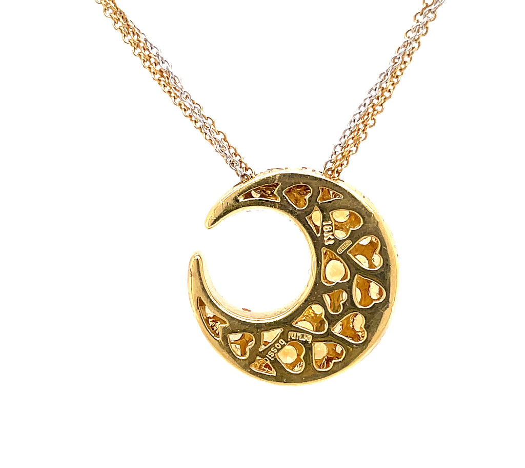 A crescent moon 3.50 cts citrine pendant, crafted from 18k yellow gold, forms the heart of Bossio Bruni's Crescent Moon Collection. The back offers a stylish gallery design of heart shapes, and the 14k gold cable link chain features a secure lobster clasp closure. The piece is 16" in length.