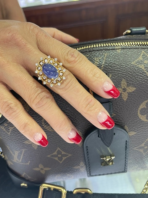 Try on view of 14k Yellow Gold Tanzanite Cabochon & Diamond Fashion Ring