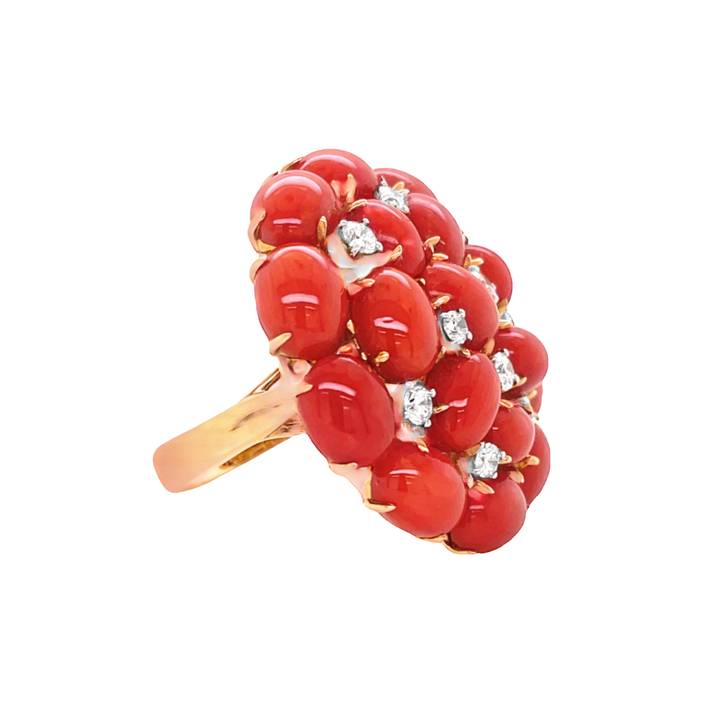 This Italian-crafted 18K yellow gold ring is radiationg; a gallery design at the back with dandelion coral beads and white round diamonds (0.60 cts) make this piece sparkle. SIze 7. 30.00 mm