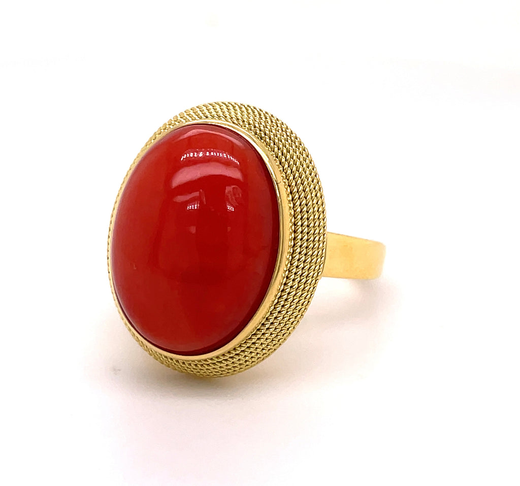 Italian made  18k yellow gold  Matte finish  7.0 size (sizable)  Natural coral cabochon 
