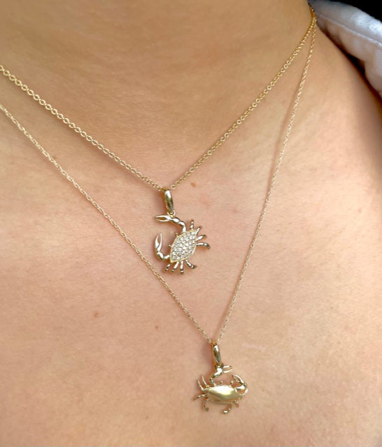Beautiful crab pendant.  14k yellow gold.  Secure bail.  22.00 mm length.  Round diamonds 0.13 cts   1.1 mm gold chain available (optional, not included in price) $199.00