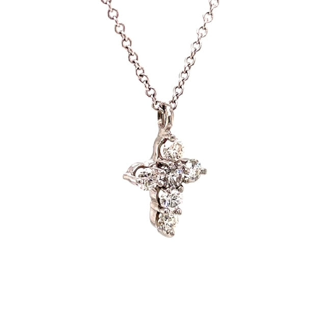 Adorned with 18k white gold, this sparkling cross pendant boasts 6 dazzling diamonds totaling 0.30 cts. Crafted in a stunning E/F color and VS clarity, this glamorous piece measures 13.00 mm with bail. Complete the look with an optional 16" white gold chain for $160.