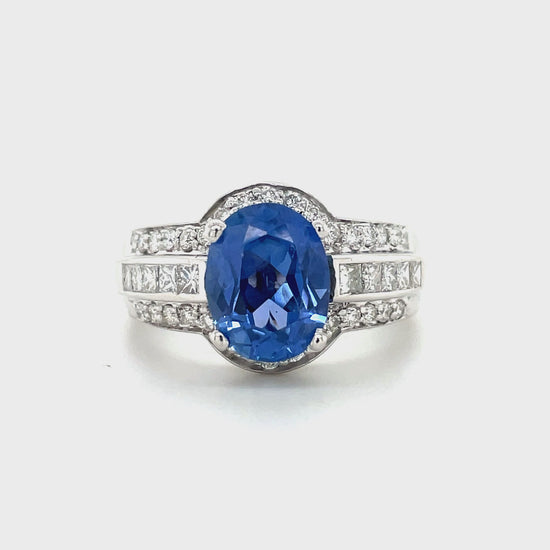 18k white gold  7.0 size (sizable)  Thick & wide ring   Faceted oval blue sapphire 2.96 cts  Round diamonds 1.20 cts  12.50 mm wide tapered 6.50 mm 