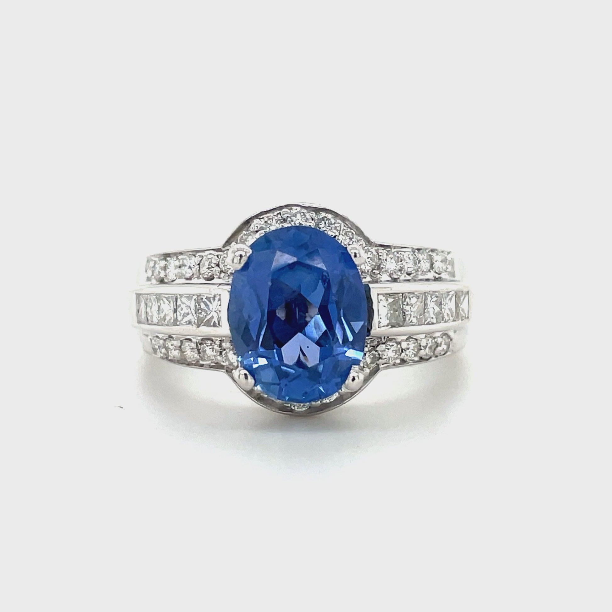 18k white gold  7.0 size (sizable)  Thick & wide ring   Faceted oval blue sapphire 2.96 cts  Round diamonds 1.20 cts  12.50 mm wide tapered 6.50 mm 