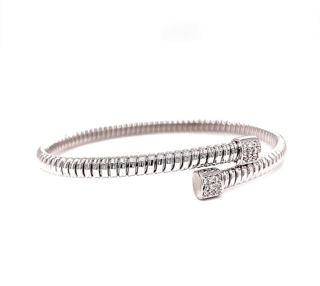 A premium quality bracelet with an adjustable design. Crafted in 18k white gold, this luxurious piece features Tubogas technology for maximum flexibility and is adorned with sparkling round diamonds totaling 0.15 carats.