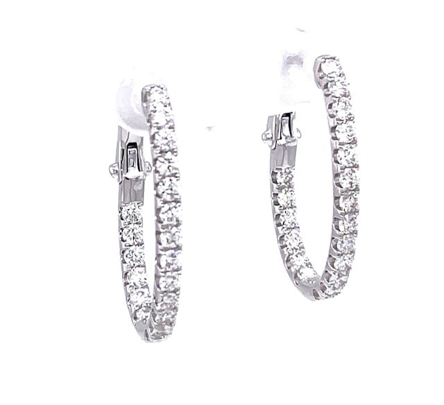 Set in 18k white gold  Round diamonds 1.32 cts  Color F/G  Clarity VS1  Secure latch system  25.50 mm long  16.00 mm wide 