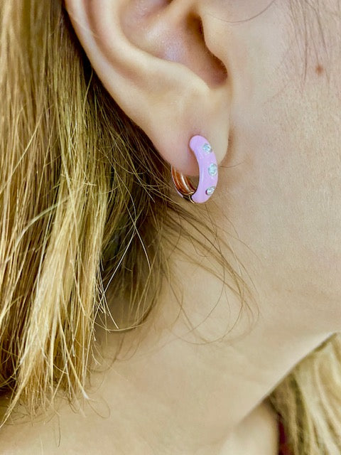 Try on view of 14k Rose Gold Pink Enamel & Diamond Huggie Earrings