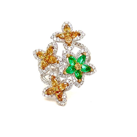 This is a magnificent conversation piece  Set in 18k white gold  7 size (sizeable)  Pear shape yellow diamonds & round diamonds 2.11 cts   Color F/G  Clarity VS1  Oval shape emeralds 0.38 cts 