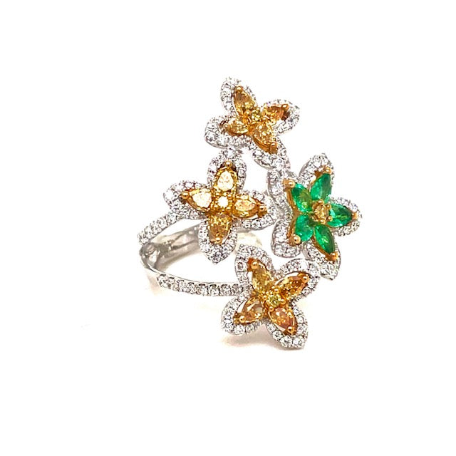 This is a magnificent conversation piece  Set in 18k white gold  7 size (sizeable)  Pear shape yellow diamonds & round diamonds 2.11 cts   Color F/G  Clarity VS1  Oval shape emeralds 0.38 cts 