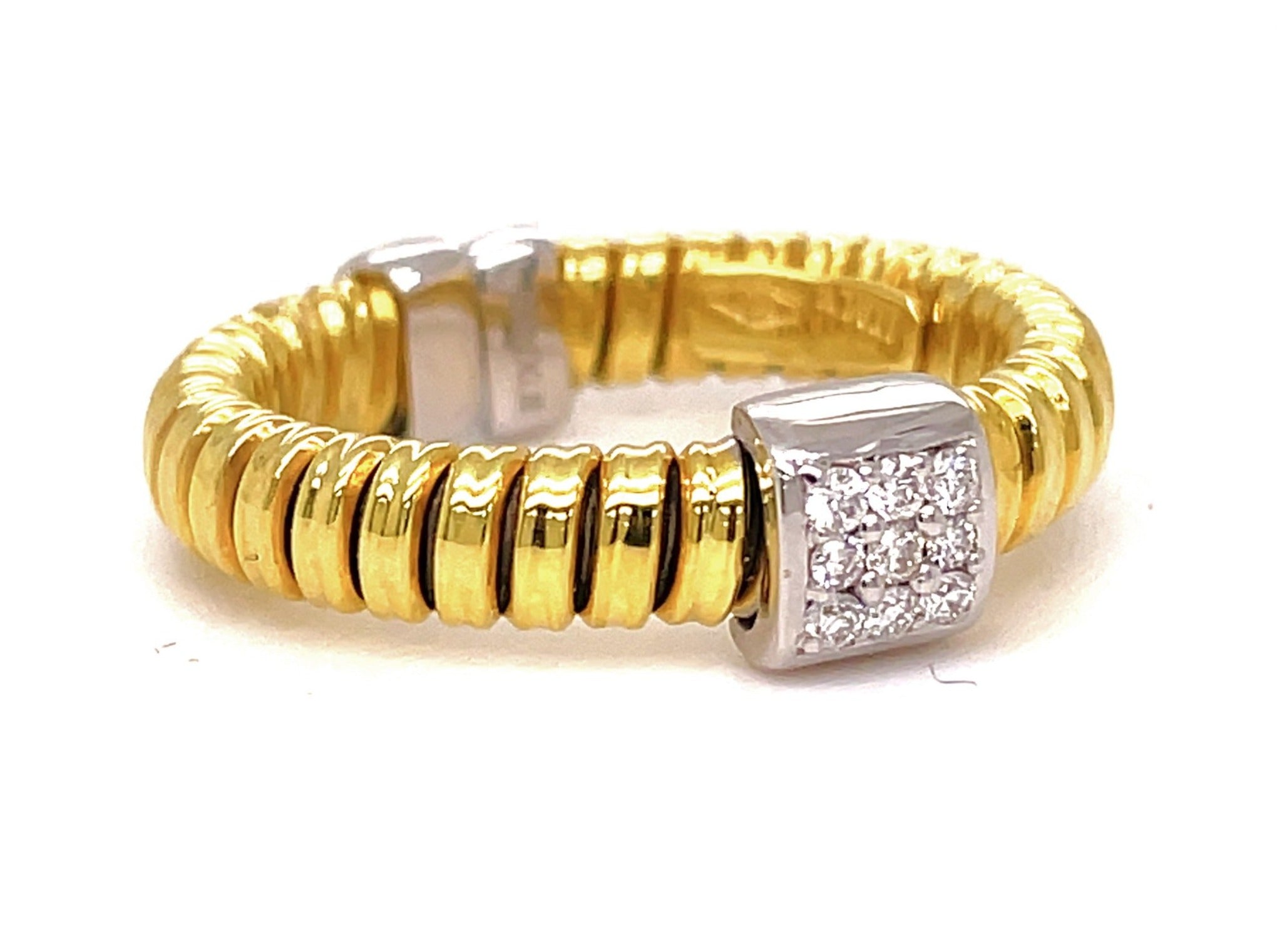 This 18k Italian Yellow Gold Diamond Square Motif Flexible Ring is crafted using an innovative tubogas technique that results in a flexible design. The 4.15mm width ring features a classic yet contemporary design, with 0.07cts of round diamonds. This ring is size 6.5, but can be resized.
