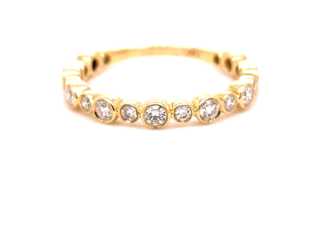 Set in 14k yellow gold  Round diamonds 0.50 cts  Bezel set two size diamonds  Easy to stack