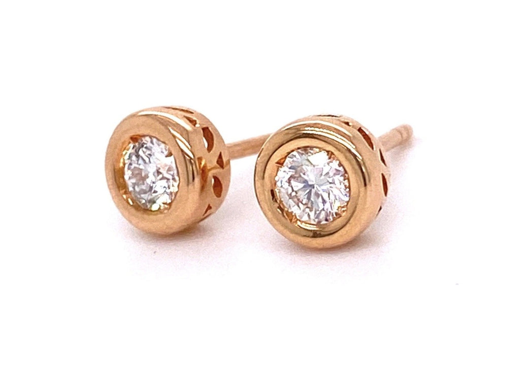 Diamond bezel stud earrings 18k rose gold  Secure friction backs   White round diamonds 0.36 cts  Gallery design on the side of the earring
