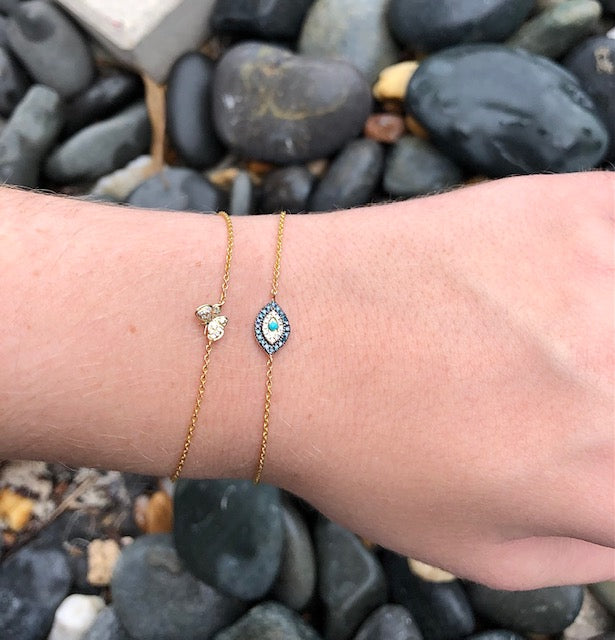 Try on view of Diamond Oval Evil Eye Yellow Gold Bracelet
