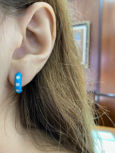 Try on view of 14k Rose Gold Blue Enamel & Diamond Huggie Earrings