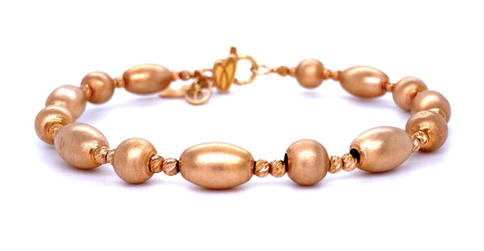 Front view of fastened 14k Rose Gold Bead Bangle with Matte Finish