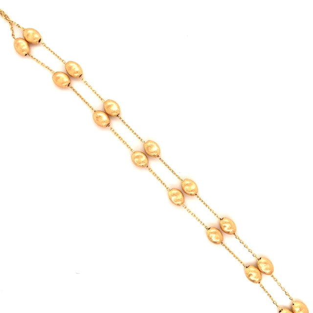 14k Yellow Gold  Two strands  7" long  Secure lobster catch.   8 Small pebbles on each strand