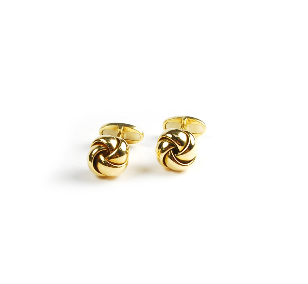 Beautifully designed 18k yellow gold cufflinks. The luxurious heavy weight and high polish give an elevated, sophisticated look with every wear. Make a bold statement with the timeless knot style. 26.4 grams, 12.90 mm