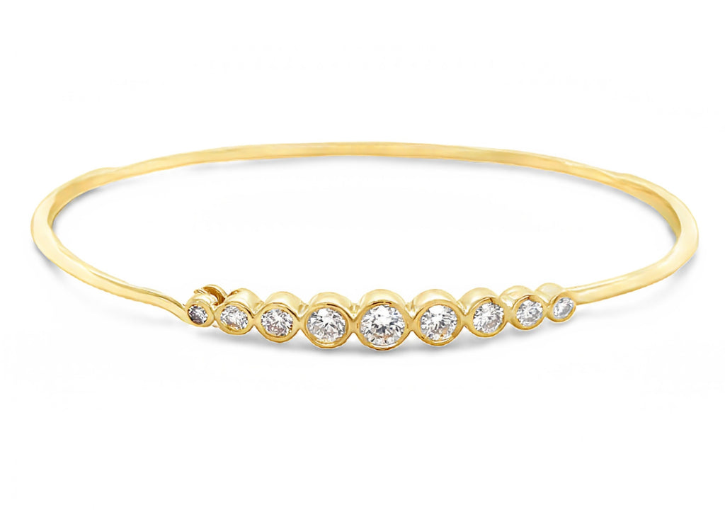 Dainty diamond bracelet 0.64 cts  9 round diamonds   14k Yellow Gold  Opens at fornt  You can stack it or wear it alone 