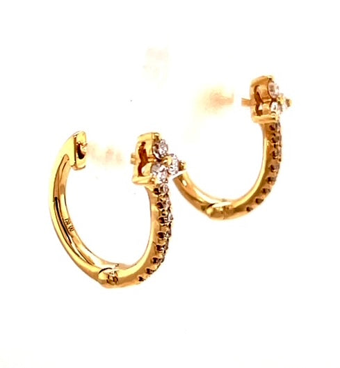 18k yellow gold.  Round diamonds 0.26 cts  14.00 mm long  Secure hinged system  Easy to wear.