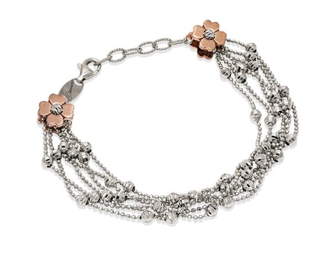 High precision diamond cut silver beads  white rhodium coated.  Two double 18k rose gold-plated flowers.  6 sterling silver rows  8" long.  Italian collection from Officina Bernardi  1" Adjustable chain  Secure lobster clasp.   