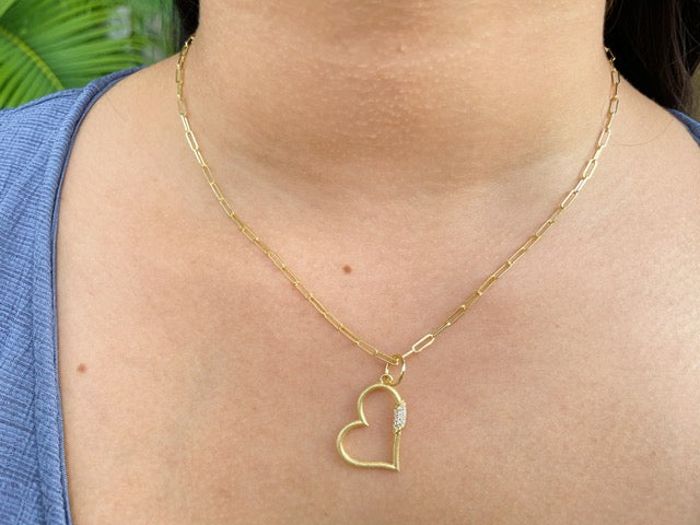 This 14k yellow gold necklace showcases a classic paperclip link design and a secure lobster catch. Its 16" long chain is 2.00 mm thick and features a 22.00 mm long gold heart with a 0.07 cts diamond, creating a timeless, elegant look.