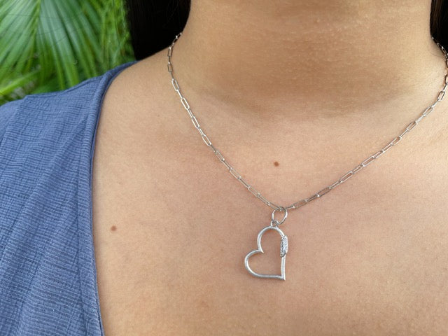 This ultra-elegant and secure necklace is crafted from 14k white gold and features a paperclip link chain and a 0.07ct diamond-studded Italian-made heart charm for a shimmering finish. The lobster clasp ensures the 16-inch-long necklace with a 2.00mm thickness stays securely in place.
