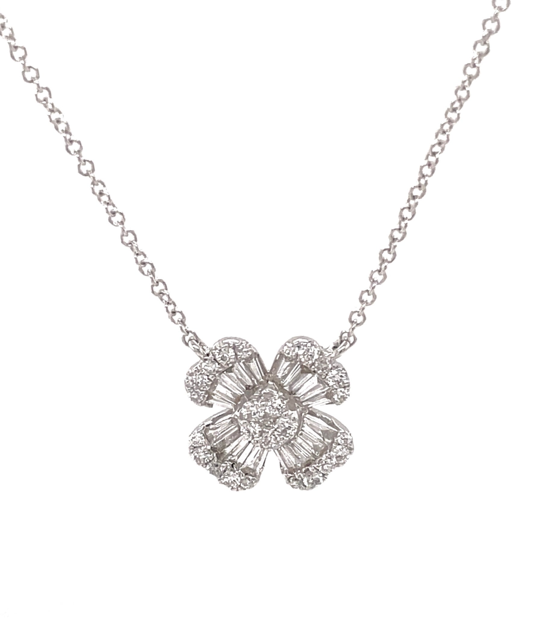 This stylish design is crafted in 14k white gold and features 0.98 carats of round and baguette diamonds for extra sparkle. Hangs from an 18-inch, 1.1 mm wide white gold chain with sizing loop. The pendant measures at 12.90 mm long, making it the perfect accessory for any outfit.