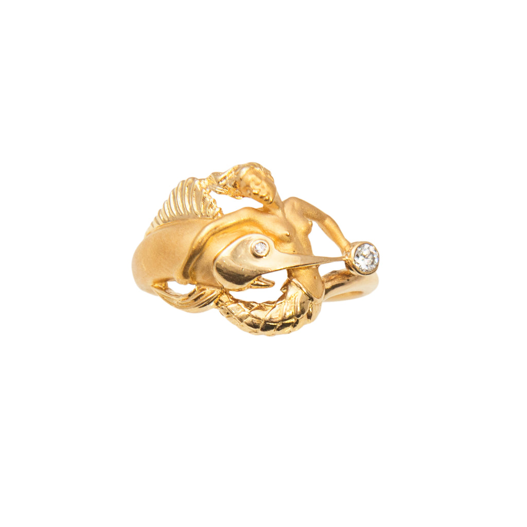 18k yellow gold mermaid and sailfish design, Carrera y Carrera trademark, one round diamond 0.10 cts, matte finish. 