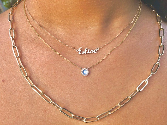 This captivating diamond evil eye necklace sparkles with 22 diamonds (0.04 carats)set in 14k yellow gold. The chain measures 17" in length, with a sizing loop at 16" for a secure fit and features a lobster clasp.  You can treasure this piece of jewelry for years to come.