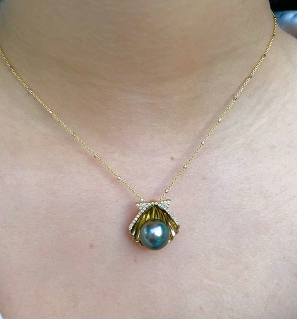 14k yellow gold  Slider system  Round diamonds 0.16 cts  10.00 mm fresh water pearl.  17.00 mm length.  1.1 mm gold chain available (optional, not included in price) $199.00