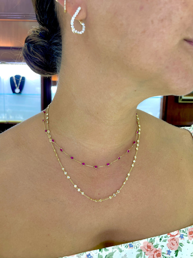 Beautiful facet rubys necklace set in 18k yellow gold.  25 rubys.  Secure catch.  18" long with sizing loop at 16"   