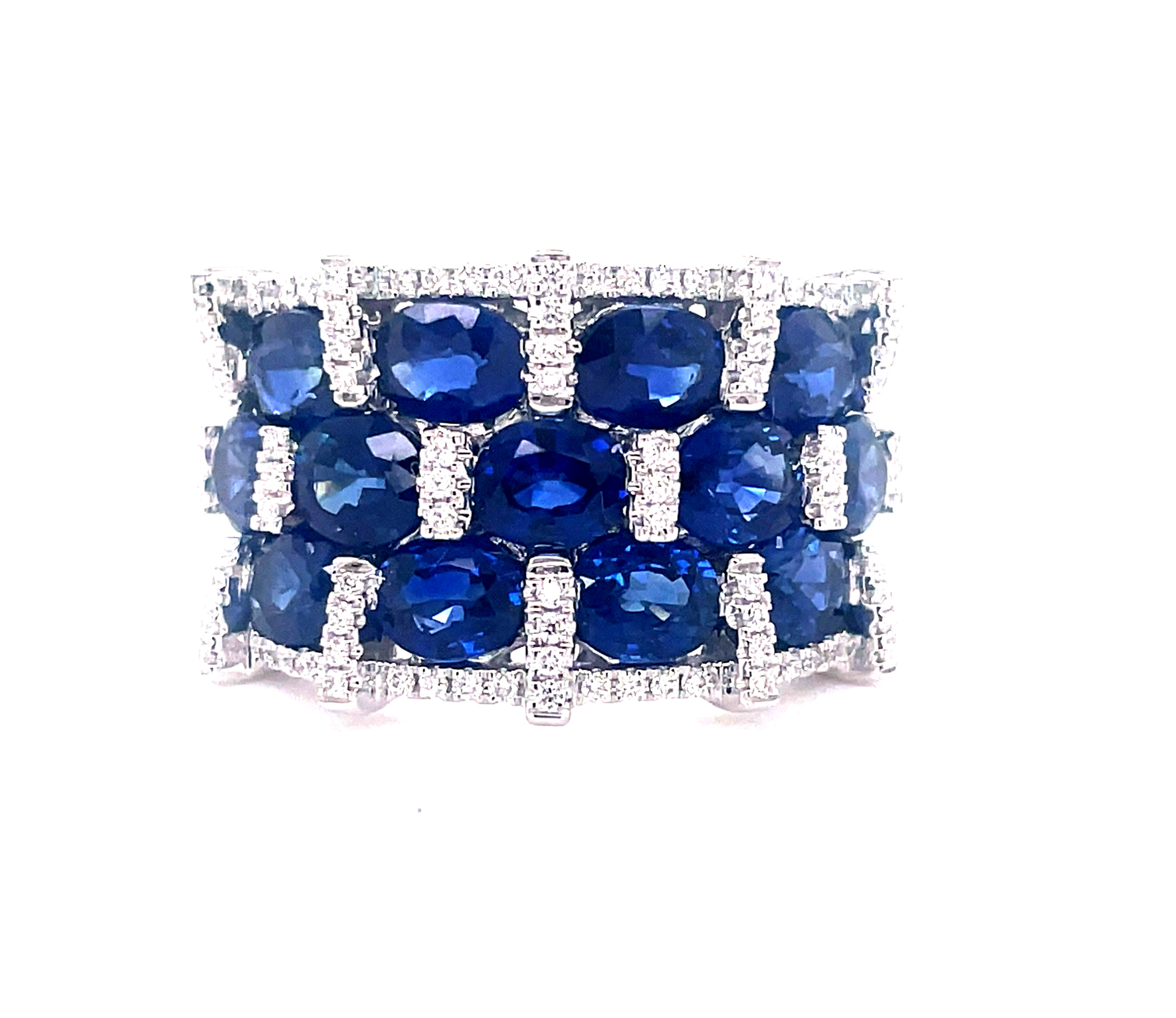 Stunningly crafted in 14k white gold, this regal ring flaunts oval sapphires at 5.36 cts and round diamonds at 0.32 cts, all set in a wide, 15.00 mm band. With an F color and VS1 clarity rating, this is a masterpiece of craftsmanship!