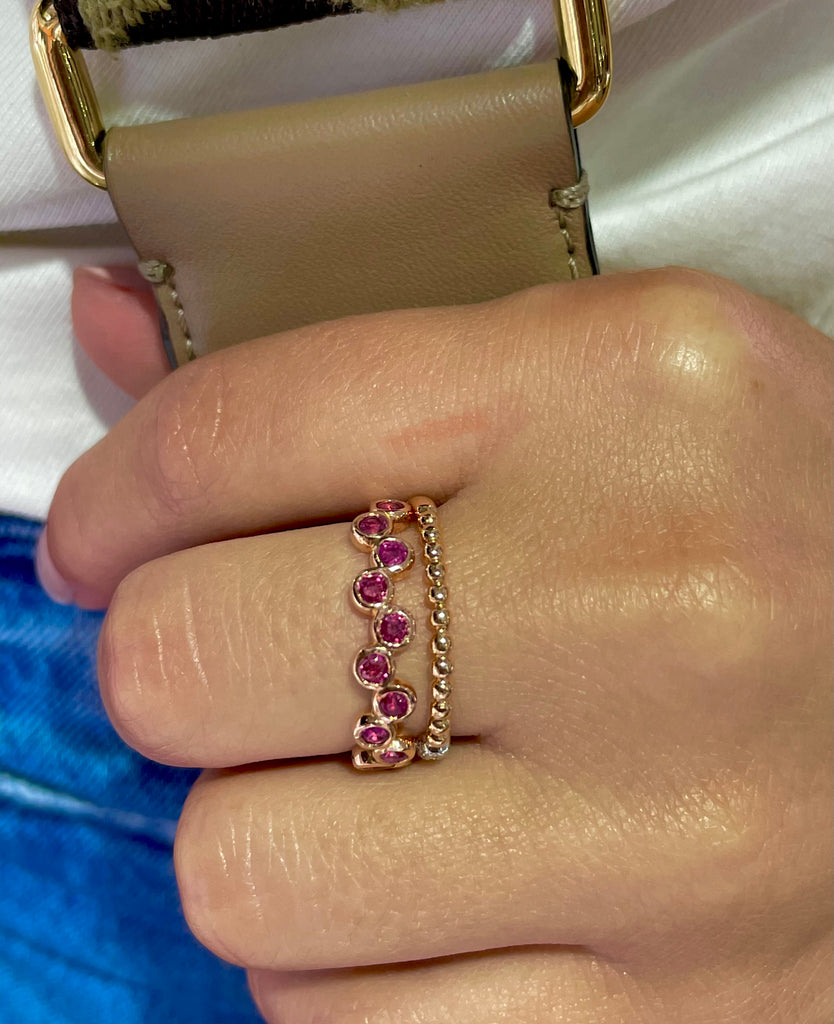 Dainty stackable ring   Set in 14k rose gold  12 round pink sapphires 0.60 cts  Bezel set  Size 7 (sizeable)