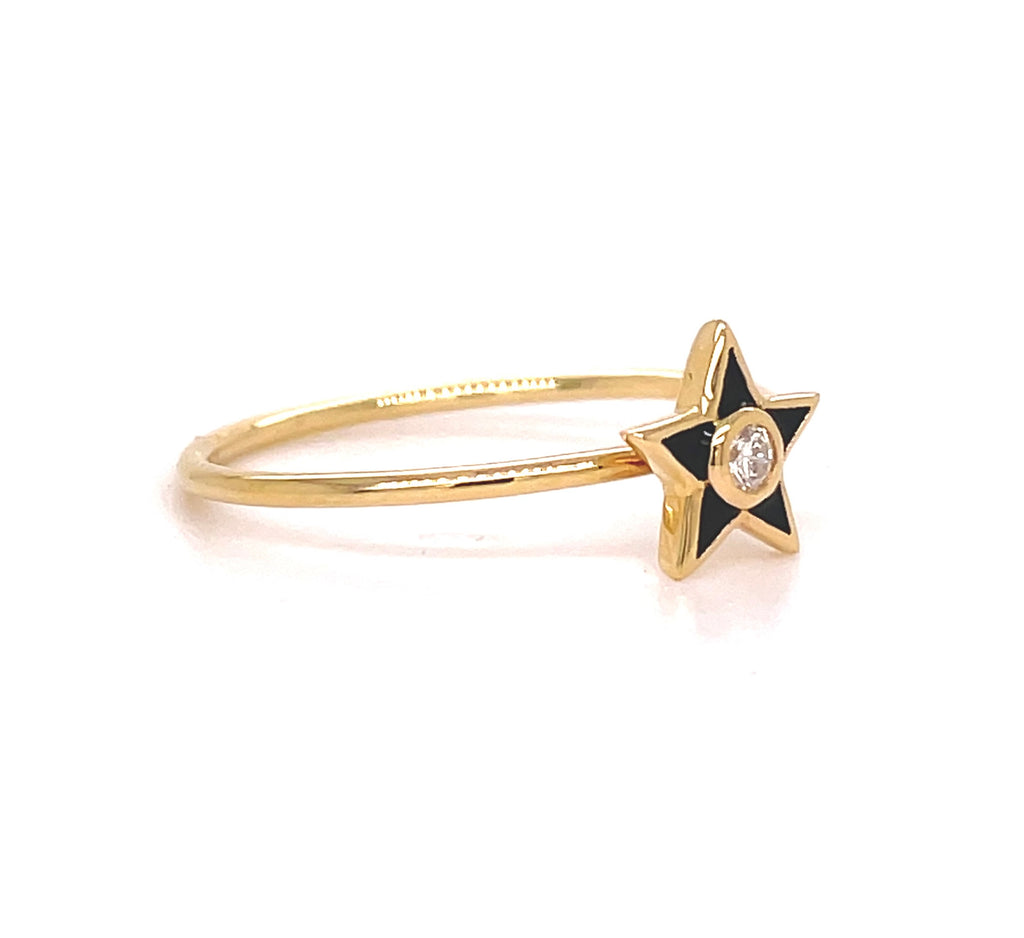This charming 18k yellow gold ring features a sleek black enamel finish for a dash of sophistication. Its round diamond sparkles with 0.05 cts. Perfect for wearing alone or stacking with complementary pieces. Size 6 (resizable).