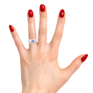 Try on view of Estate Jewelry Tanzanite & Diamond Star Engraved Ring