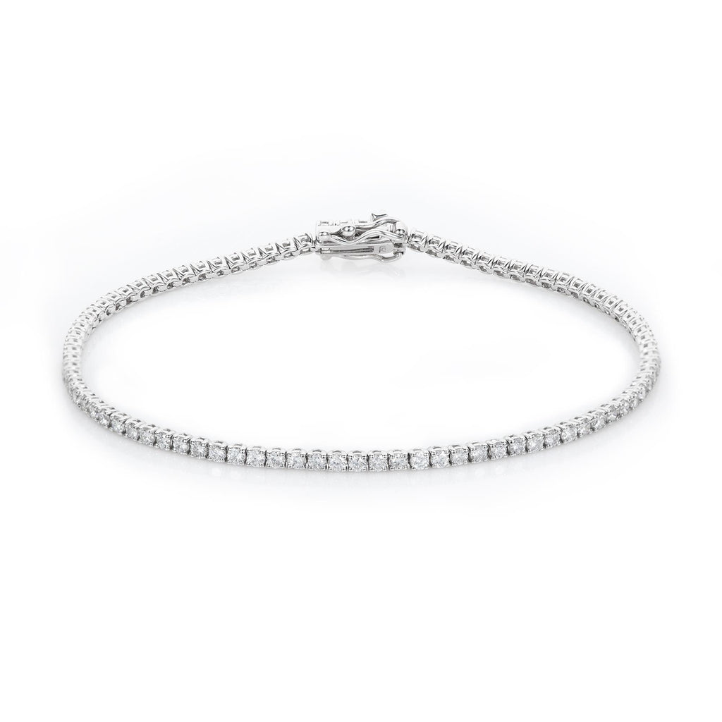 This beautiful diamond tennis bracelet boasts 2.00 carats of bright round diamonds set in 14k white gold. The diamonds are of color H/I and clarity SI1, so you can be sure of their sparkle. The perfect gift for your loved one!