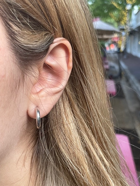 Beautifully crafted 14k Italian white gold hoops earrings perfect for a night on the town, or for every day style! Durable yet lightweight, these 0.5" earrings will add just the right touch of luxury and sparkle to any look. Make a statement with these gorgeous little hoops!